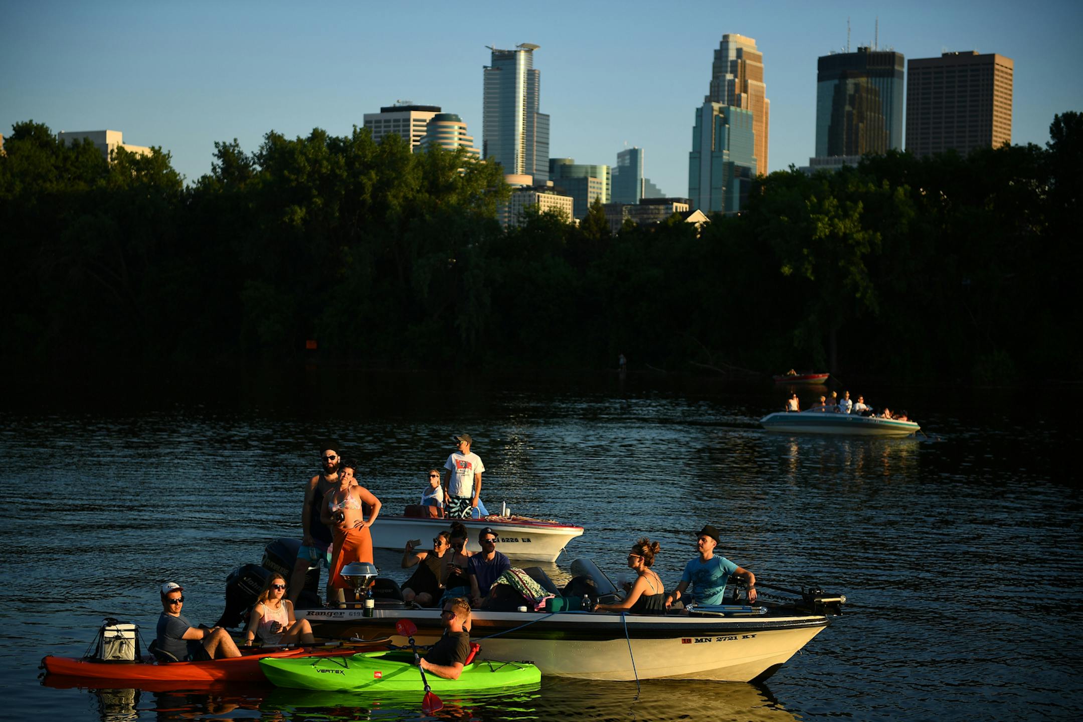 Boaters watched Rock the Garden from the Mississippi River Saturday. ] (AARON LAVINSKY/STAR TRIBUNE) aaron.lavinsky@startribune.com