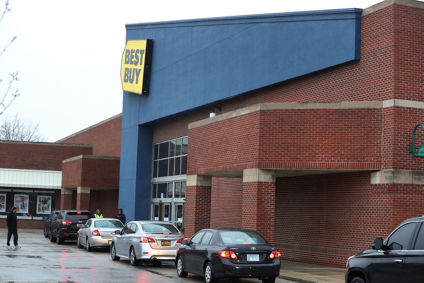 Best Buy will allow shoppers back into about 200 of its nearly 1,000 stores by appointment only. It will continue to offer curbside pickup for items, as shown here at a store in the Chicago area last month.