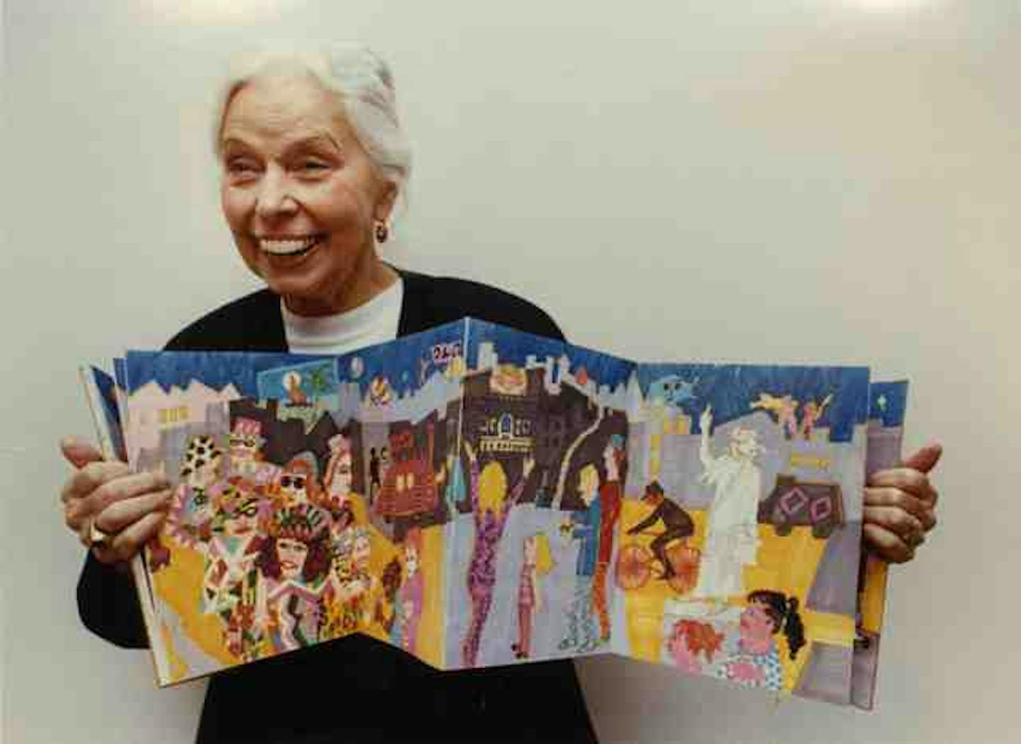 Phyllis Wiener unfolded a Prismacolor book she made, symbolizing "the pulse of life," in 1993, when a retrospective of her work was shown at Macalester College.