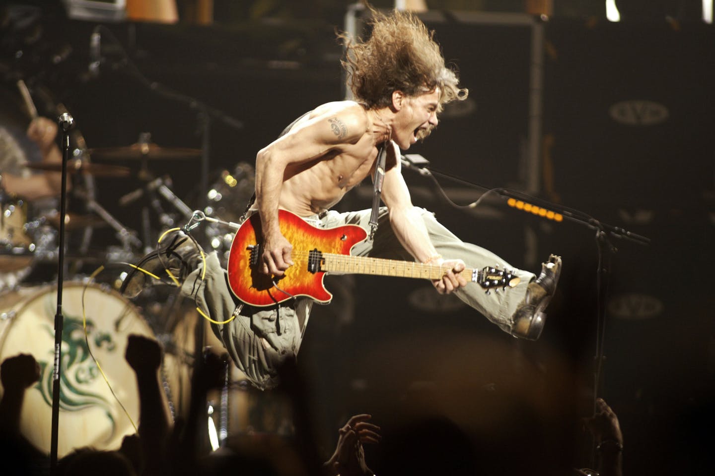 Eddie Van Halen, shown in a 2004 concert in New Jersey playing the last chord of "Jump," died Oct. 6.