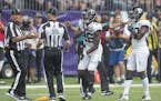 Referees discussed the penalty on Jacksonville's defensive back Jarrod Wilson during the fourth quarter the Minnesota Vikings took on the Jacksonville