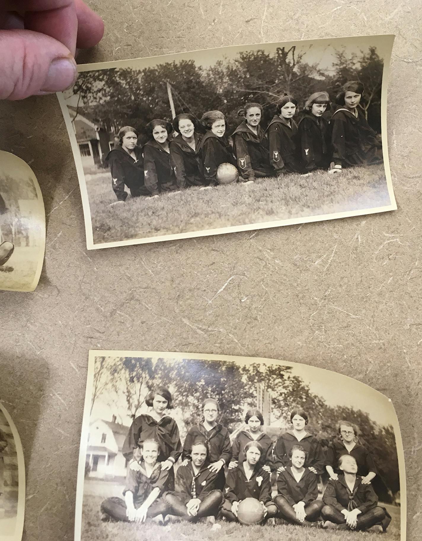 Beatrice Dupuy &#xef; beatrice.dupuy@startribune.com
Dennis Dvorak, founder of the New Prague Historical Society, holds up a photo of the girls&#xed; basketball team from 1923. Dvorak plans to put the New Prague High School time capsule on display at the New Prague Memorial Library in the fall.