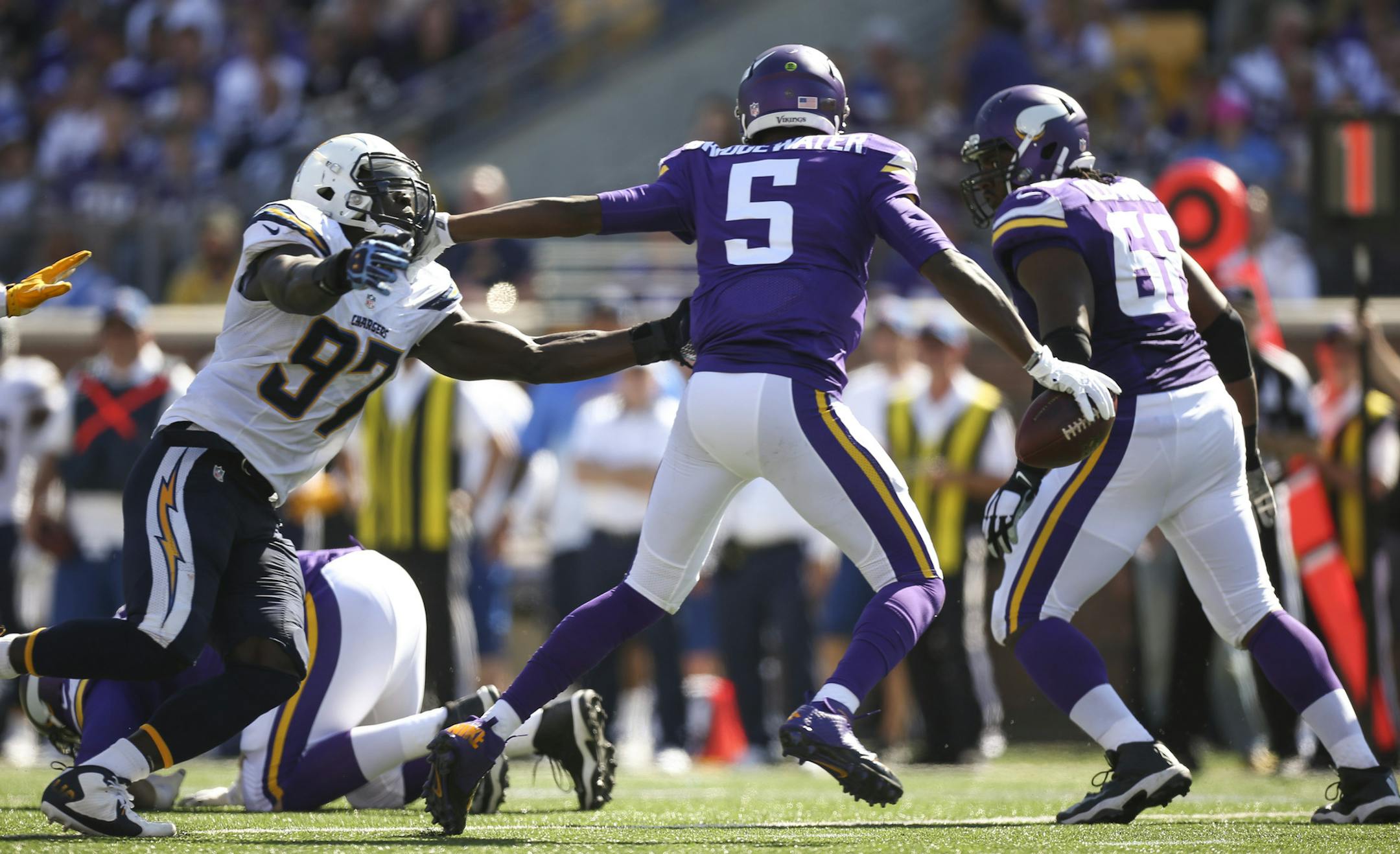 Chargers outside linebacker Jeremiah Attaochu (97) pursued Vikings quarterback Teddy Bridgewater (5) in the second quarter Sunday afternoon. Bridgewater managed to get a pass off while holding off Attaochu. ] JEFF WHEELER &#xef; jeff.wheeler@startribune.com The Minnesota Vikings beat the San Diego Chargers 31-14 in an NFL football game Sunday afternoon, September 27, 2015 at TCF Bank Stadium in Minneapolis.