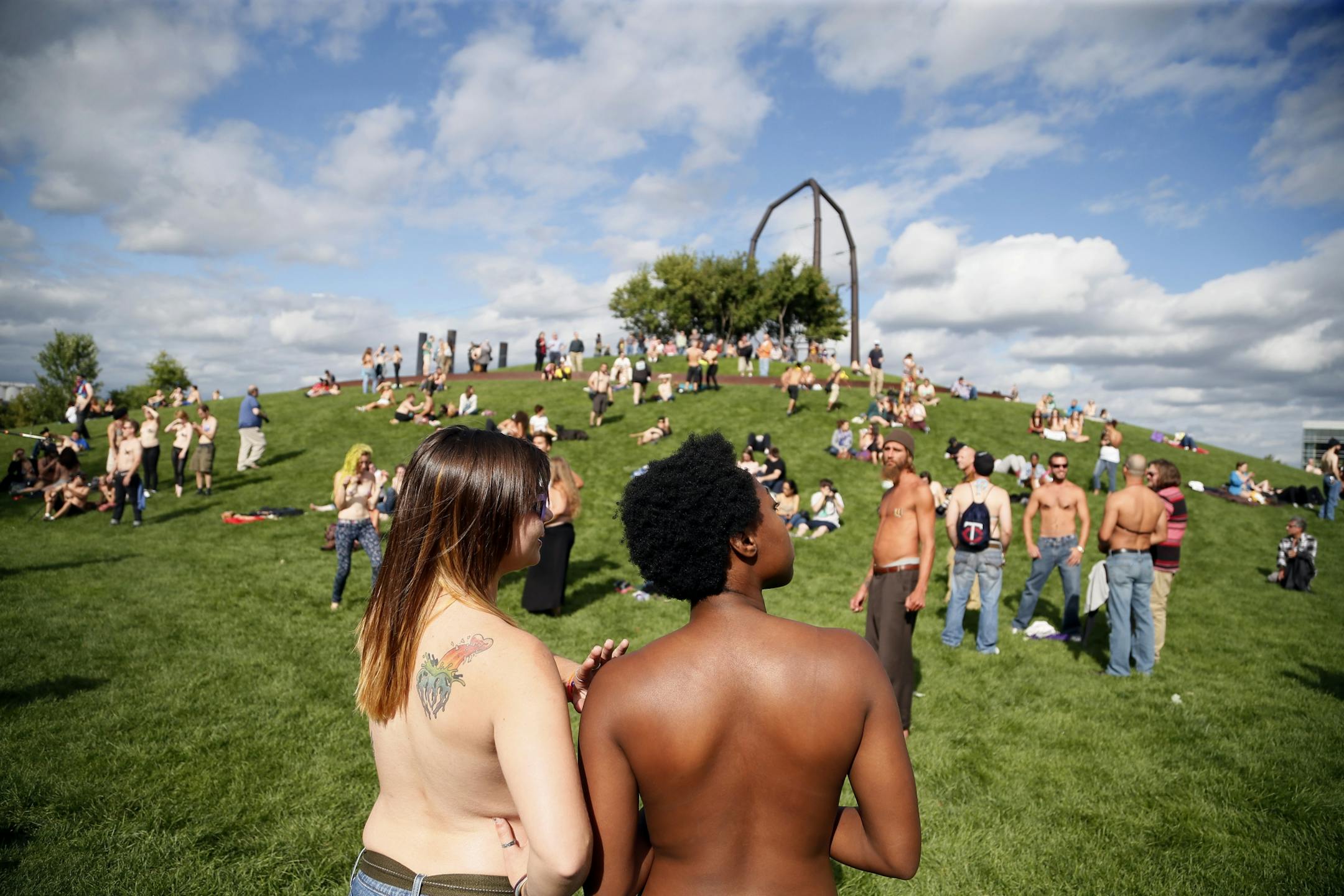 Saying it's a matter of gender equity and freedom of expression, topless demonstrators gathered at Gold Medal Park Sunday August 23, 2015 in Minneapolis, MN.