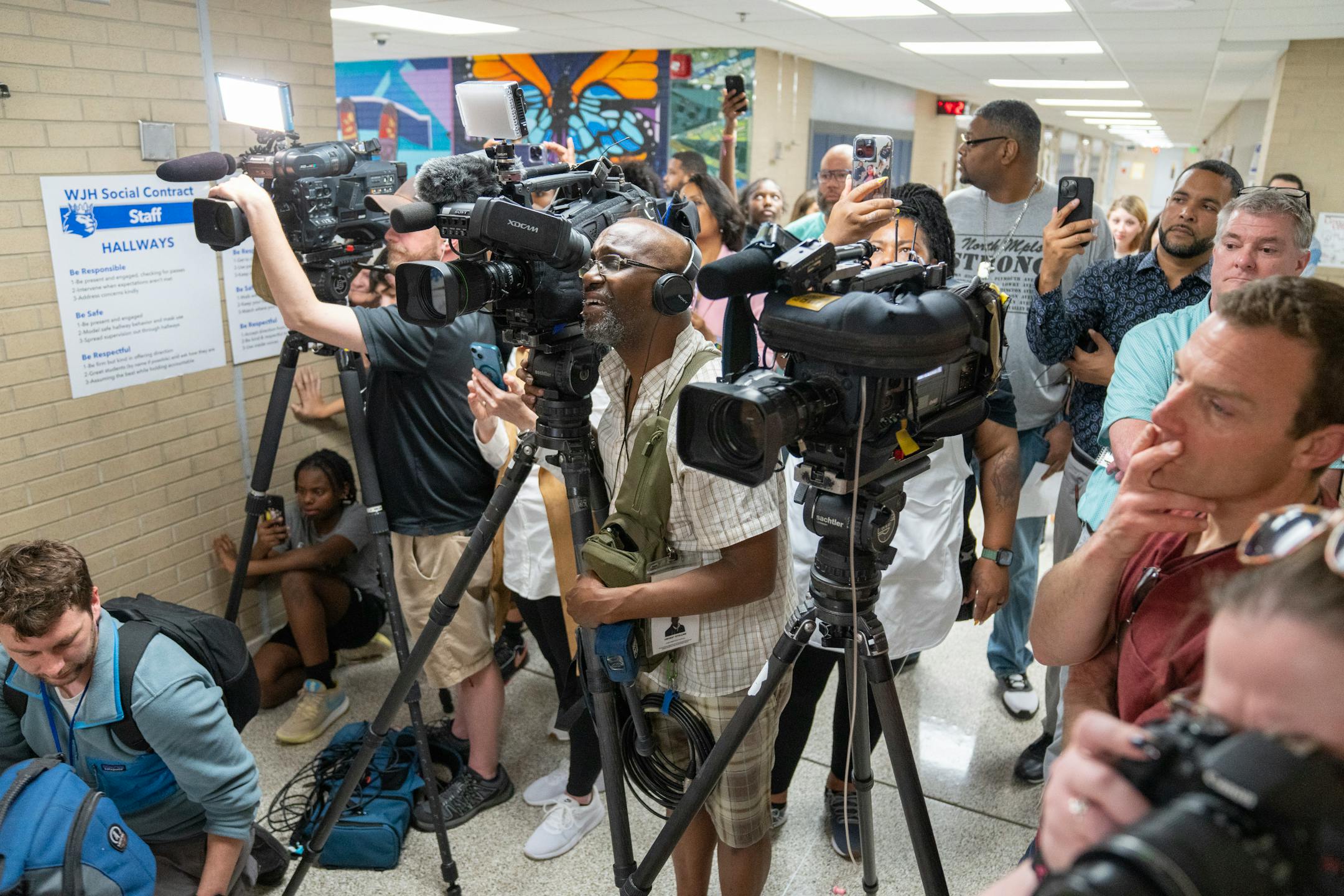 A throng of media,teachers and students gathered to listen to Paige Bueckers during a grand opening ceremony for a new free grocery store.