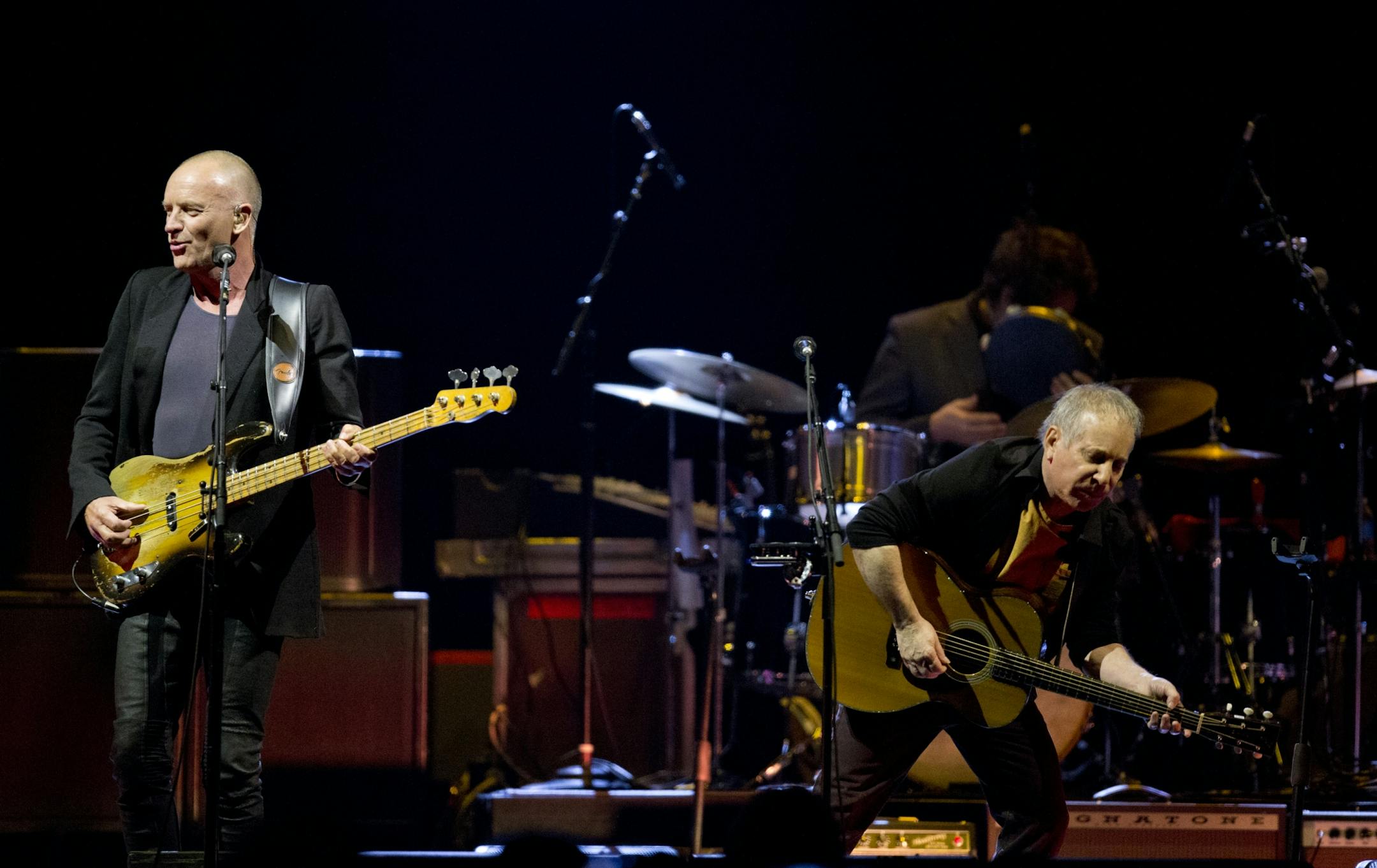 Longtime New York neighbors Sting and Paul Simon decided to hit the road and tour together. The Paul Simon & Sting: On Stage Together tour stopped at Xcel Energy Center in St. Paul Sunday night, February 23, 2014. Sting, left, and Paul Simon performing Sting's "Brand New Day" to open their set Sunday night at Xcel Energy Center.
