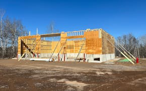 Work on a public works garage in Proctor has been stalled while two companies and the city are tied up in a legal battle.