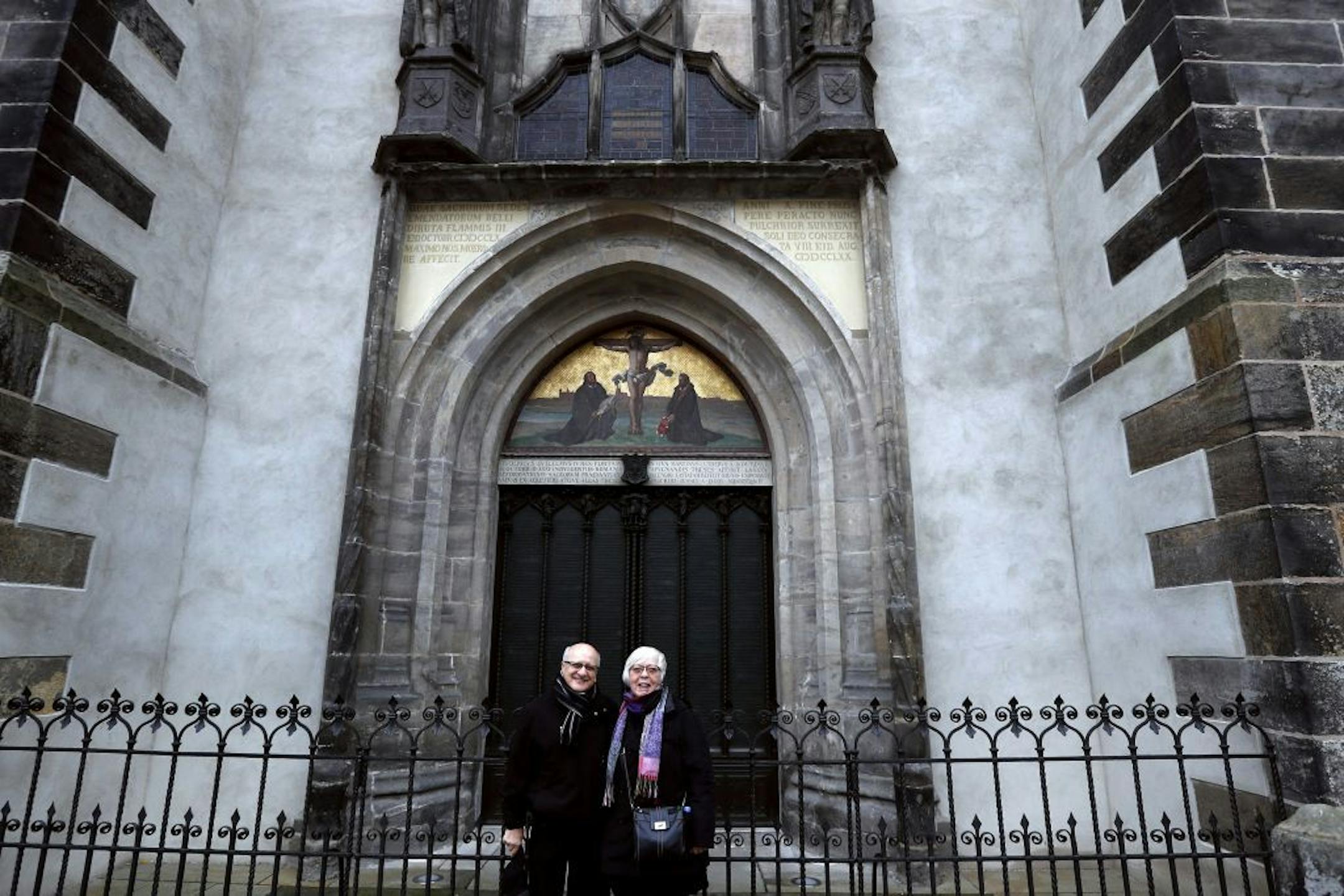 A portrait of Mahmoud Baali and his wife Virginia Baali at the legendary church doors where Martin Luther blasted the Catholic Church and unleashed the Protestant reformation Monday , October 31, 2016 in Wittenberg, Germany.