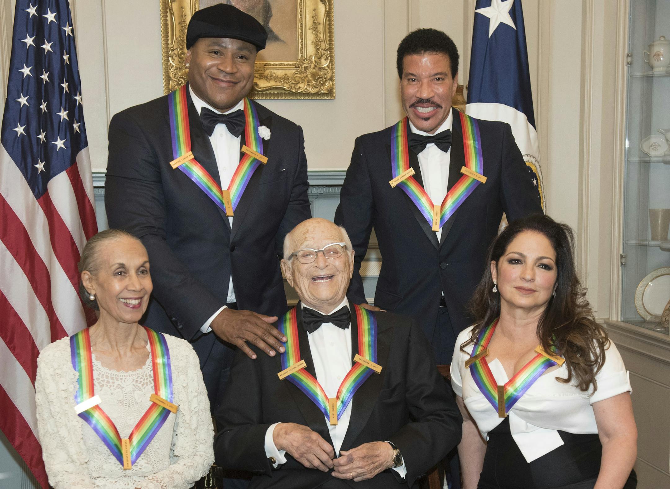Front row from left, 2017 Kennedy Center Honorees Carmen de Lavallade, Norman Lear, and Gloria Estefan, back row from left, LL Cool J, and Lionel Richie are photographed following the State Department dinner for the Kennedy Center Honors, Saturday, Dec. 2, 2017, in Washington. (AP Photo/Kevin Wolf)