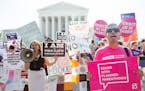 Pro-abortion rights and anti-abortion protesters rally in front of the U.S. Supreme Court in Washington, June 27, 2016.