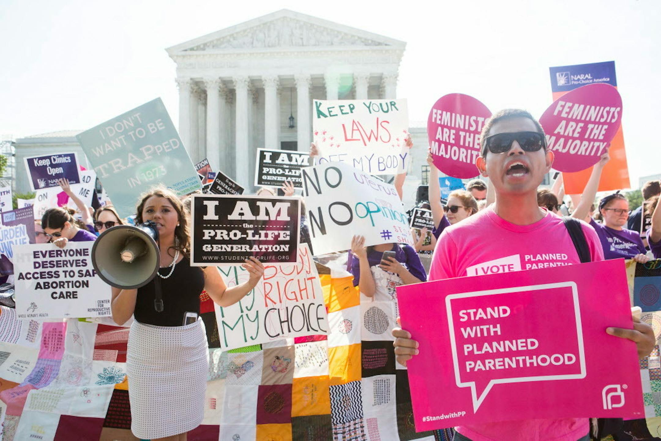Pro-abortion rights and anti-abortion protesters rally in front of the U.S. Supreme Court in Washington, June 27, 2016.