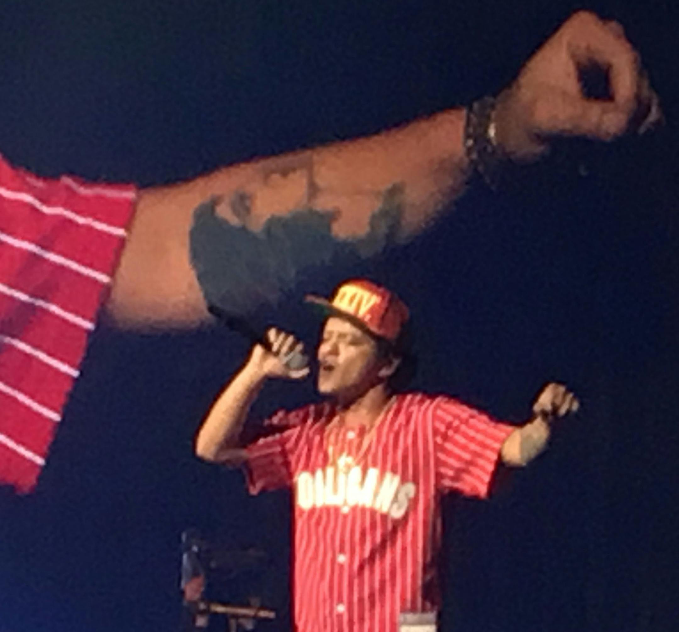 Bruno Mars, live on the Xcel Energy Center stage Saturday in St. Paul and on the video screen.