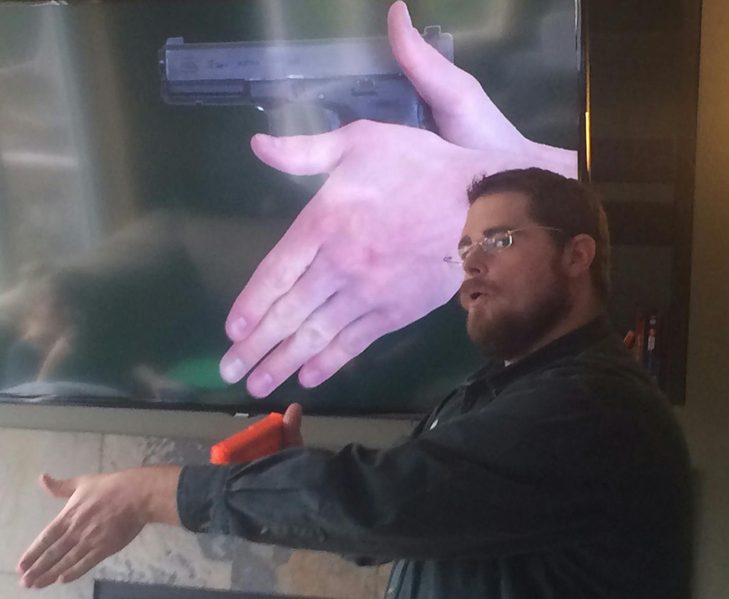 Firearms instructor Rob Doar demonstrated the proper technique for holding a handgun.