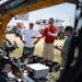 Adam Lund and Dustin Johnson looked around a precision spraying system at Farmfest on Tuesday, helped by Greeneye Technology’s Kody Paxton. Johnson 