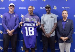 Vikings coach Kevin O'Connell, receiver Justin Jefferson, GM Kwesi Adofo-Mensah and owner Mark Wilf address the media during a news conference Tuesday