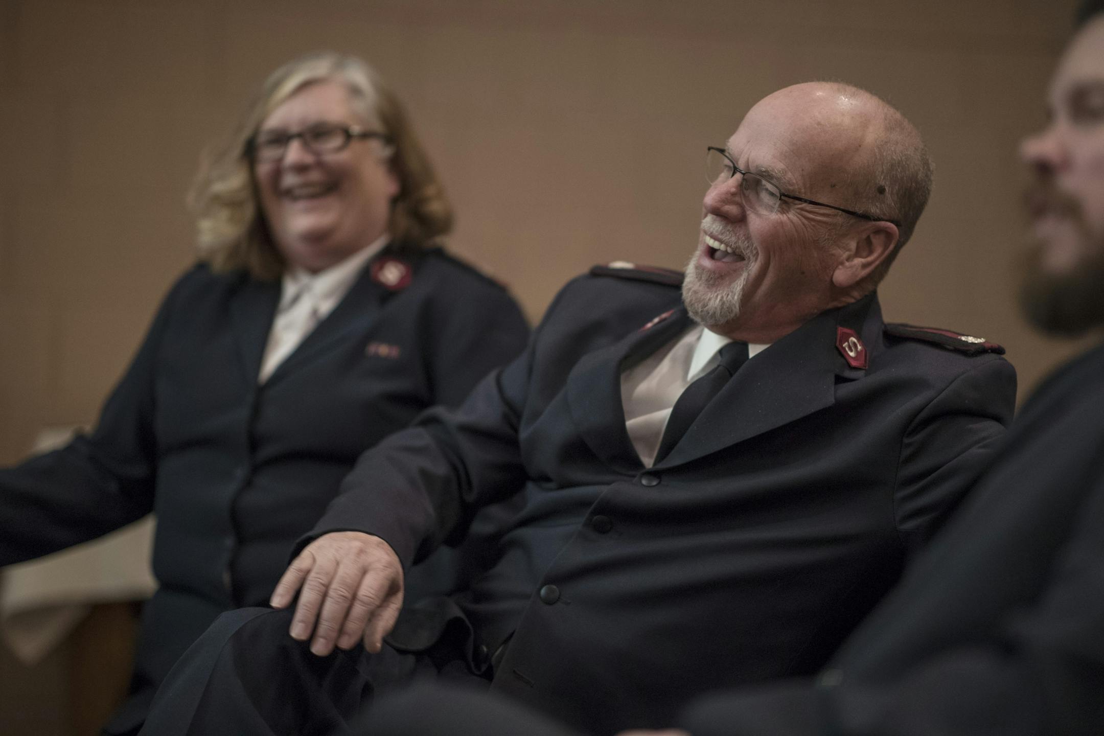 Salvation Army Lakewood Corps officers Majors Candy Curl left and her husband Jim Curl with Cadet Aaron Johnson at right during worship services at the Salvation Army Center Sunday December 10, 2017 in Maplewood MN.