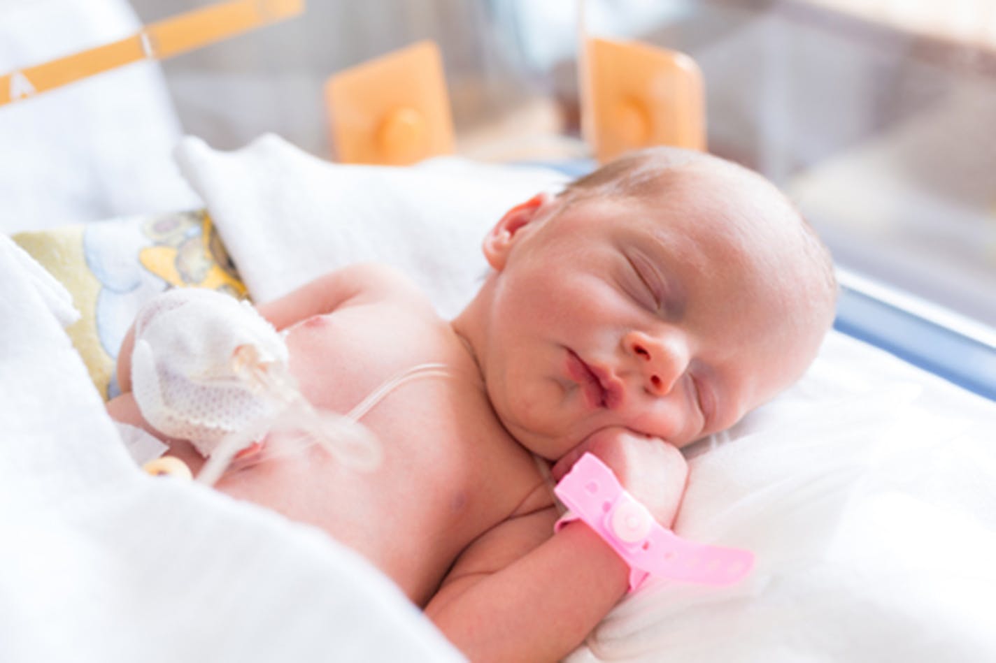 A newborn baby girl in the hospital.