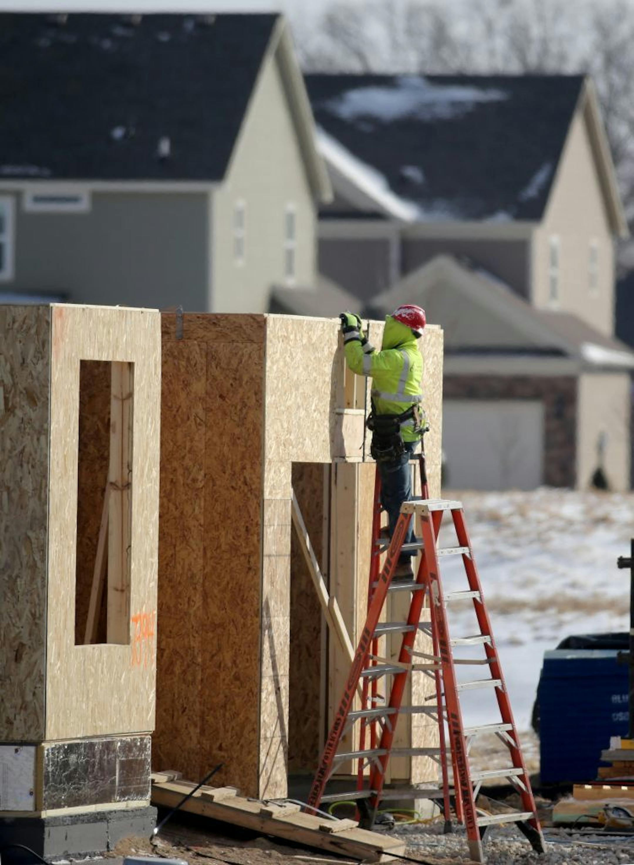 The Twin Cities is the 16th-most undersupplied housing market in the nation, according to a new report. For every 7.9 jobs created in the metro area, only one house was built from 2013 through 2015. Here, a carpenter works on a home under construction in Maple Grove in February 2015.