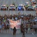 Marchers block part of Interstate 94 in St. Paul, Minn., Saturday, July 9, 2016, during a protest sparked by the recent police killings of black men i