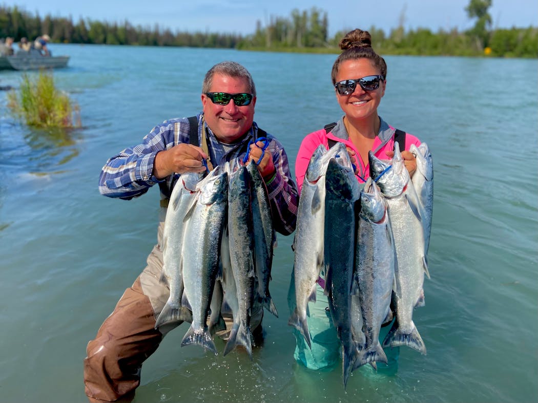 Pat, left, and Felicia Znajda, with a sockeye salmon limit in mid-July outside Soldotna, Alaska.