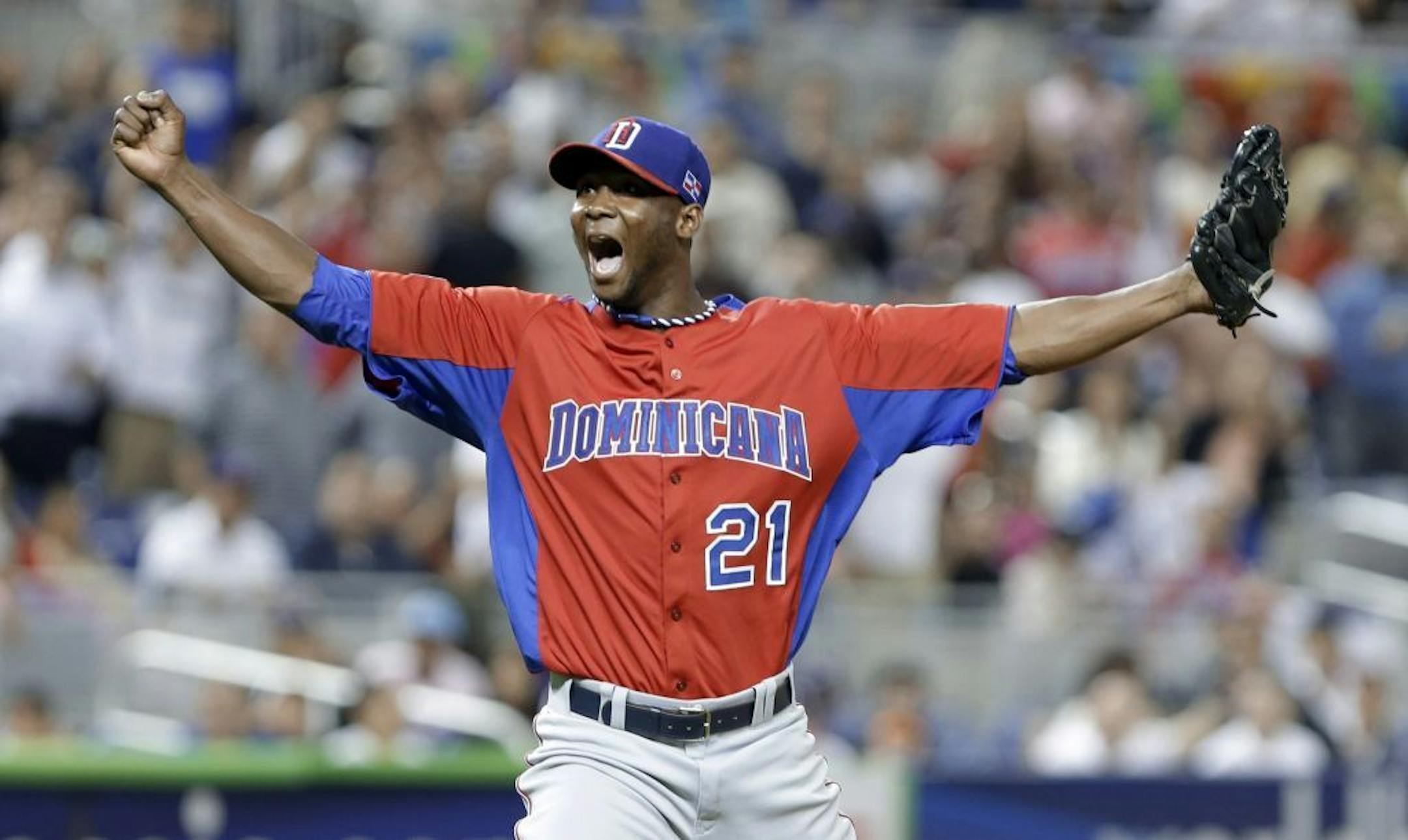 Dominican Republic pitcher Samuel Deduno reacts after striking out United States' Adam Jones.