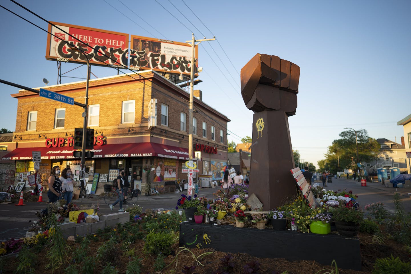 The evolving memorial to George Floyd at the intersection of 38th and Chicago Wednesday night.