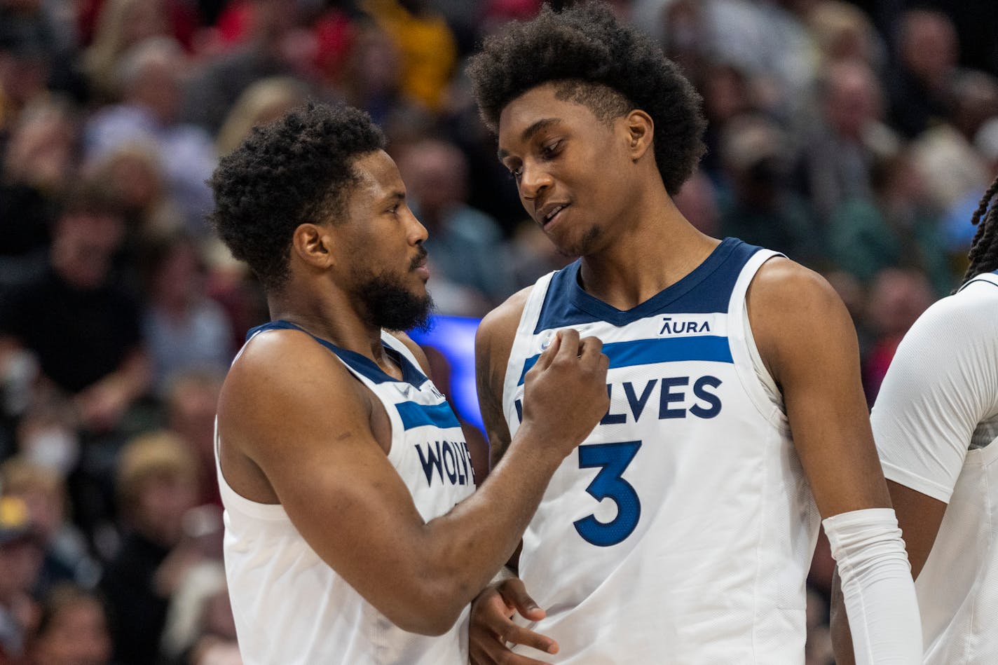 Minnesota Timberwolves guard Malik Beasley, talks to forward Jaden McDaniels (3), during a break in the action, in the second half during an NBA basketball game, Thursday, Dec. 23, 2021, in Salt Lake City. (AP Photo/Rick Egan)