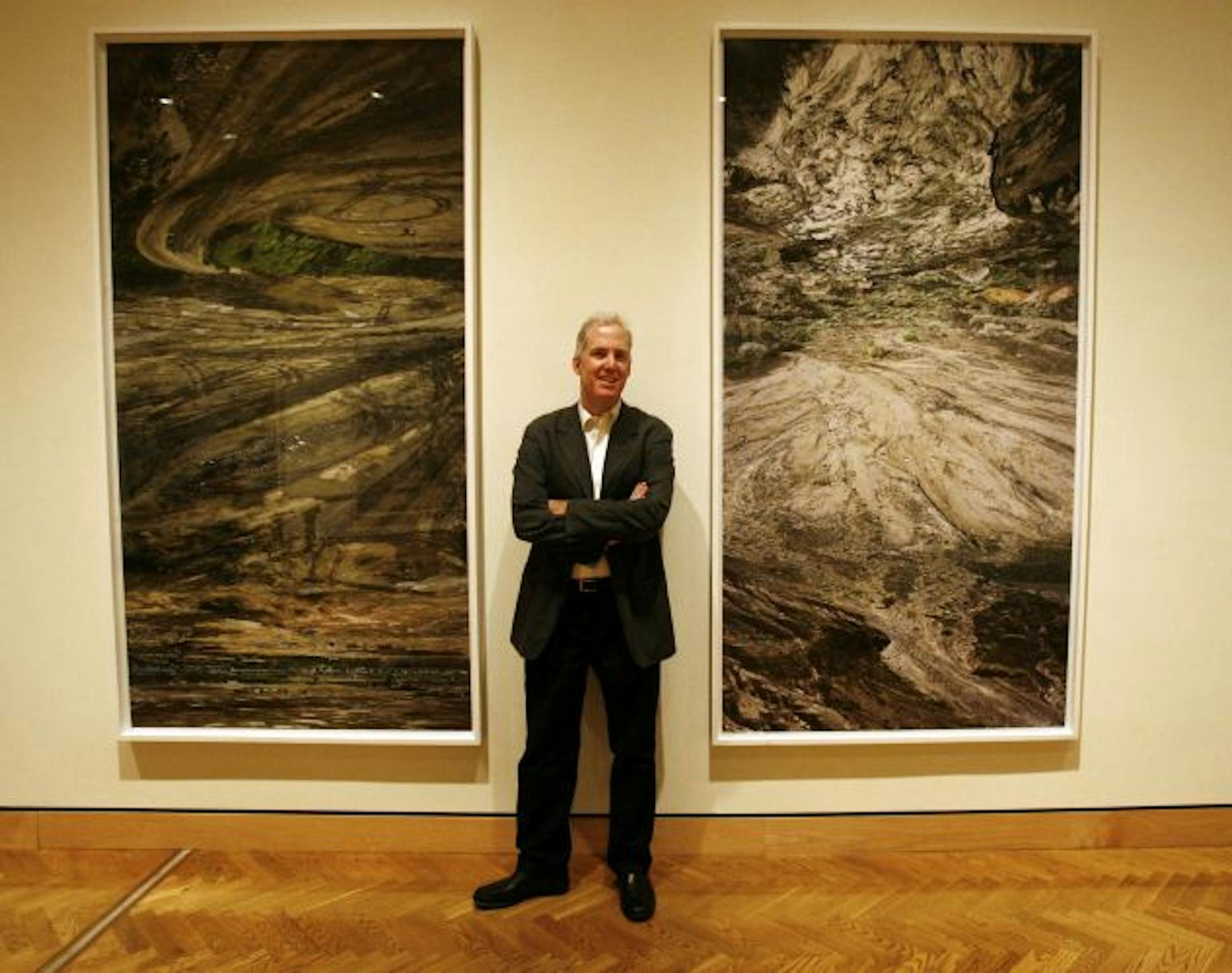 Minneapolis Institute of Arts photography curator David Little is launching on Sept. 18 a program called "New Pictures," featuring emerging artists from around the world. The first showcased artist is Noriko Furunishi with photos taken from the western United States on a 4X 5 film camera. Using post production software, Furunishi then took multiple images and often changed the orientation of one or more of the images and fused them together into one photo. Here, Little stands between the images