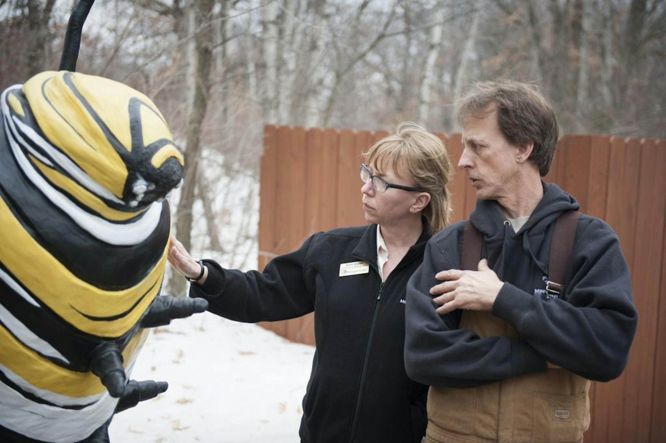 Minnesota zoo spokeswoman Beth Burns and Rick Oestreich, seen in 2014, talk about building a 3,000-pound caterpillar for the zoo's Big Bug exhibit.