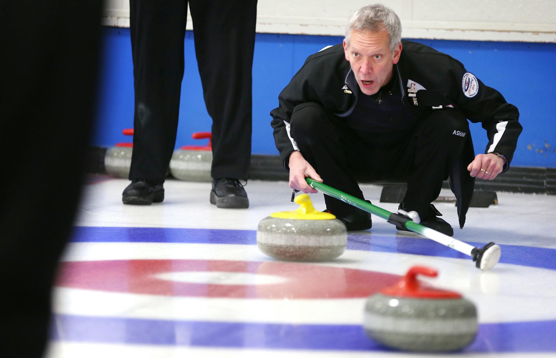 Bob Hedstrom of team Hedstrom helps guide the stone during curling league play at the St. Paul Curling Club on Wednesday, January 7, 2015. ] LEILA NAVIDI leila.navidi@startribune.com / BACKGROUND INFORMATION: The St. Paul Curling Club will be one of three local hosts of the first-ever The Big Spiel, an open curling event expected to attract nearly 100 teams from around the country.