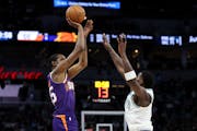 Timberwolves star Anthony Edwards, right, will spend plenty of time guarding Suns forward Kevin Durant during the teams' first-round NBA playoff serie