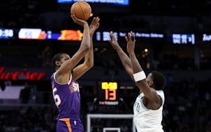 Timberwolves star Anthony Edwards, right, will spend plenty of time guarding Suns forward Kevin Durant during the teams' first-round NBA playoff serie