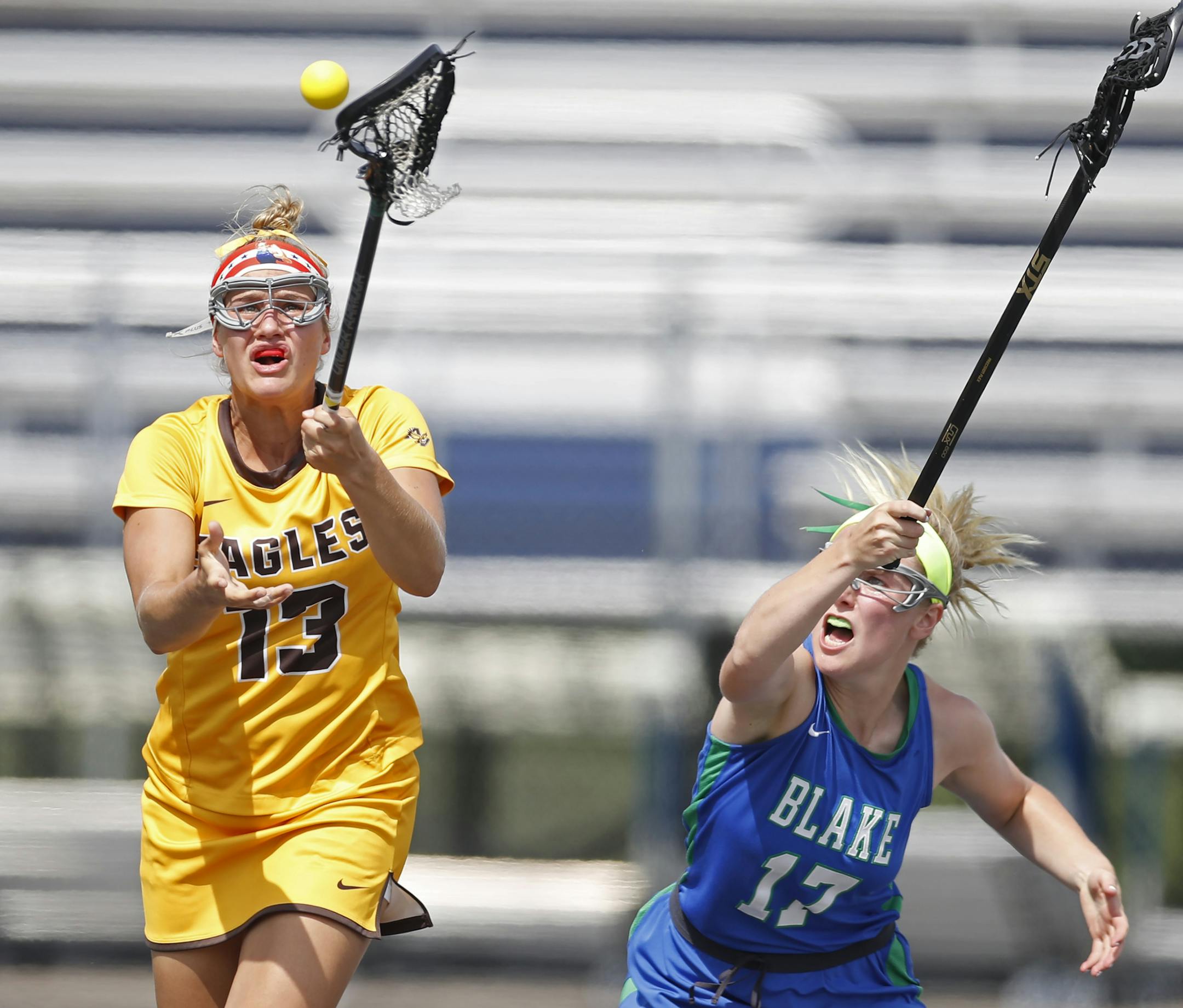 Reagan Roelofs(13) of Apple battles for the ball with Sophie Skallerud(17).] Blake and Apple Valley face off Blake in the girls' semifinals of lacrosse at Chanhassen H.S. in the MSHSL.Richard Tsong-Taatariiïrtsong-taatarii@startribune.com