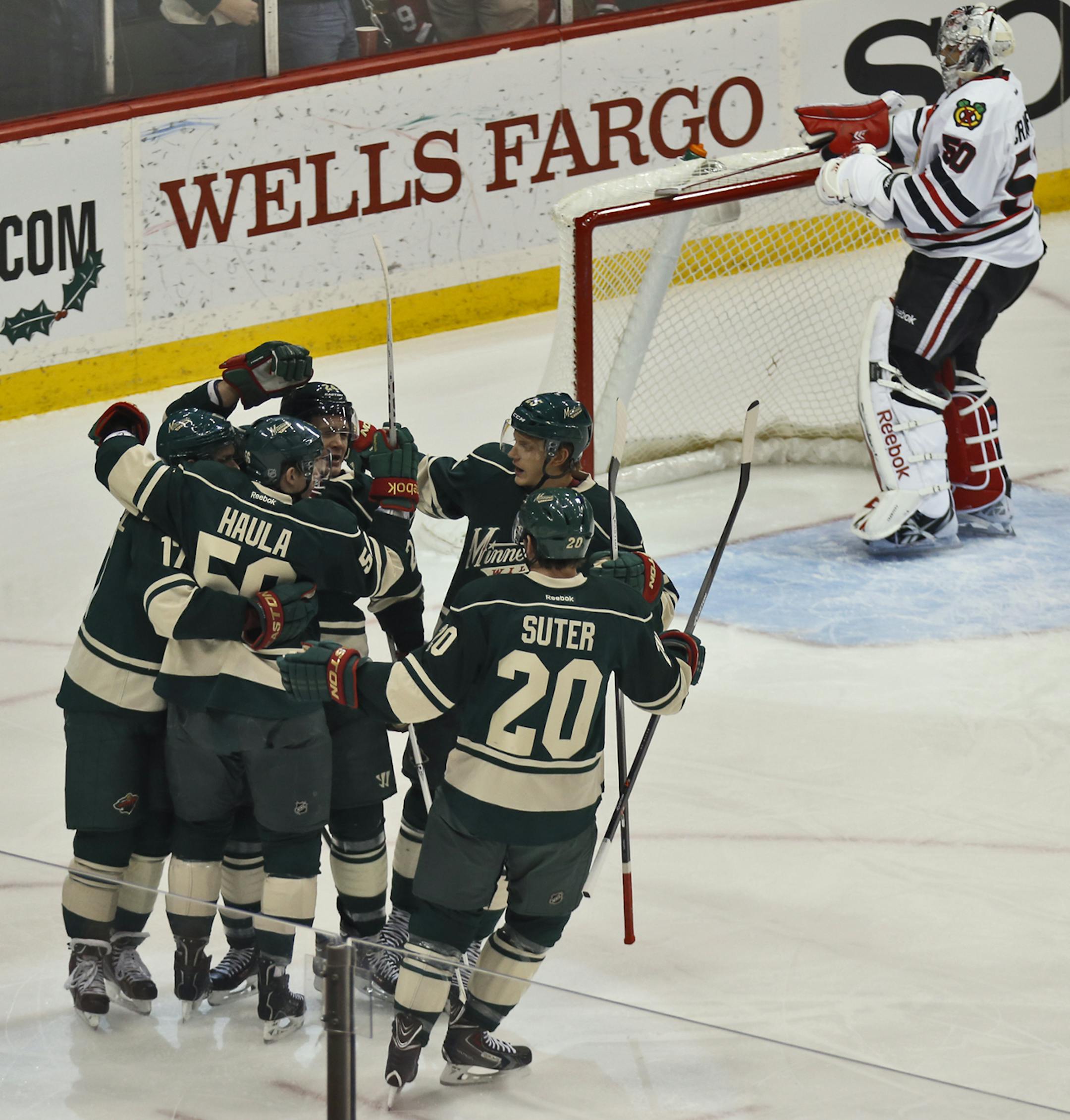 Minnesota Wild vs. Chicago Blackhawks. Wild celebrated a first period goal by Matt Cooke beating Chicago goalie Corey Crawford on the play. (MARLIN LEVISON/STARTRIBUNE(mlevison@startribune.com)