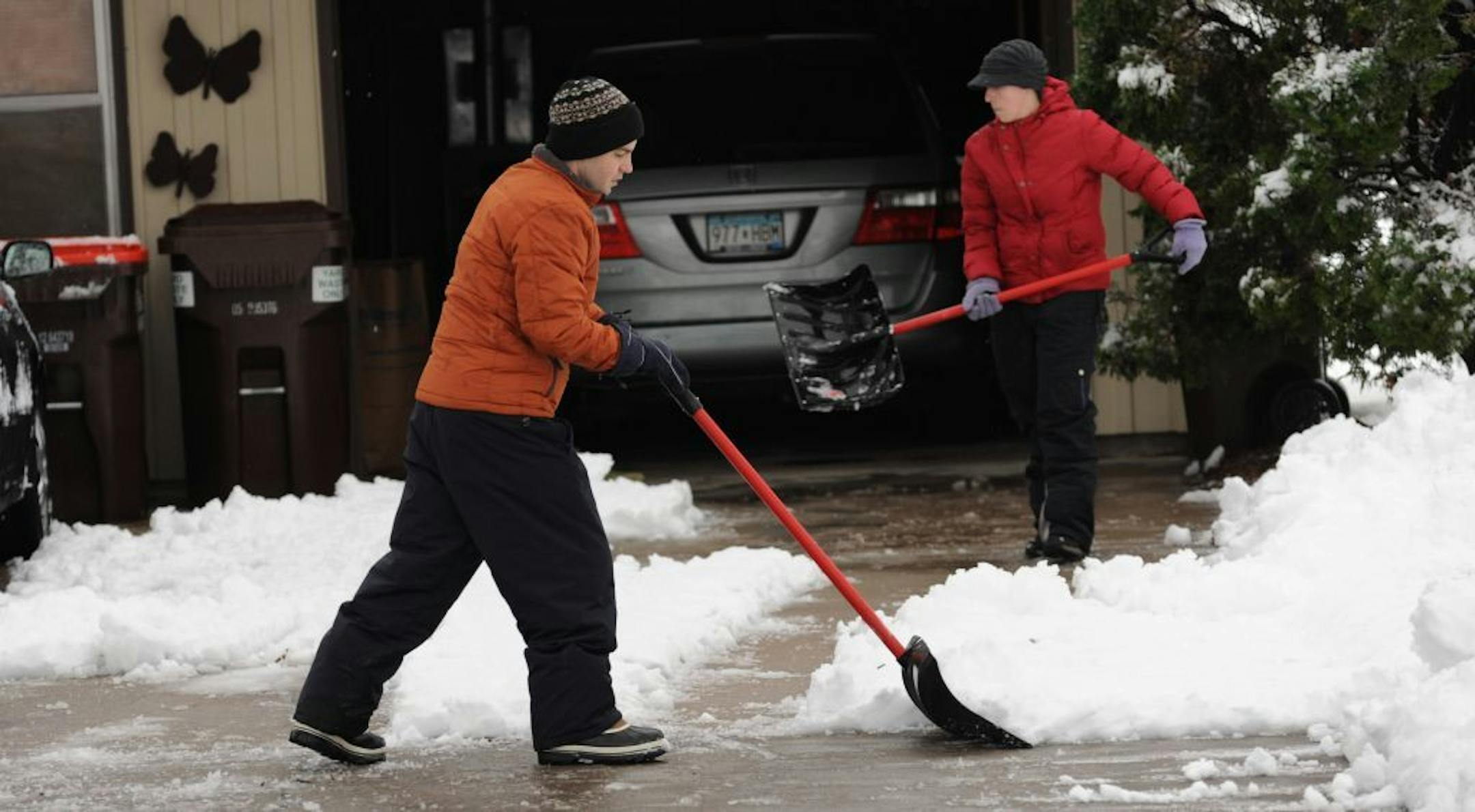 A very late spring storm dumped snow on the Hastings area overnight, slowing the morning commute. Trevor and Lara Tubbs shoveled about 6 inches of heavy wet snow in their driveway.
