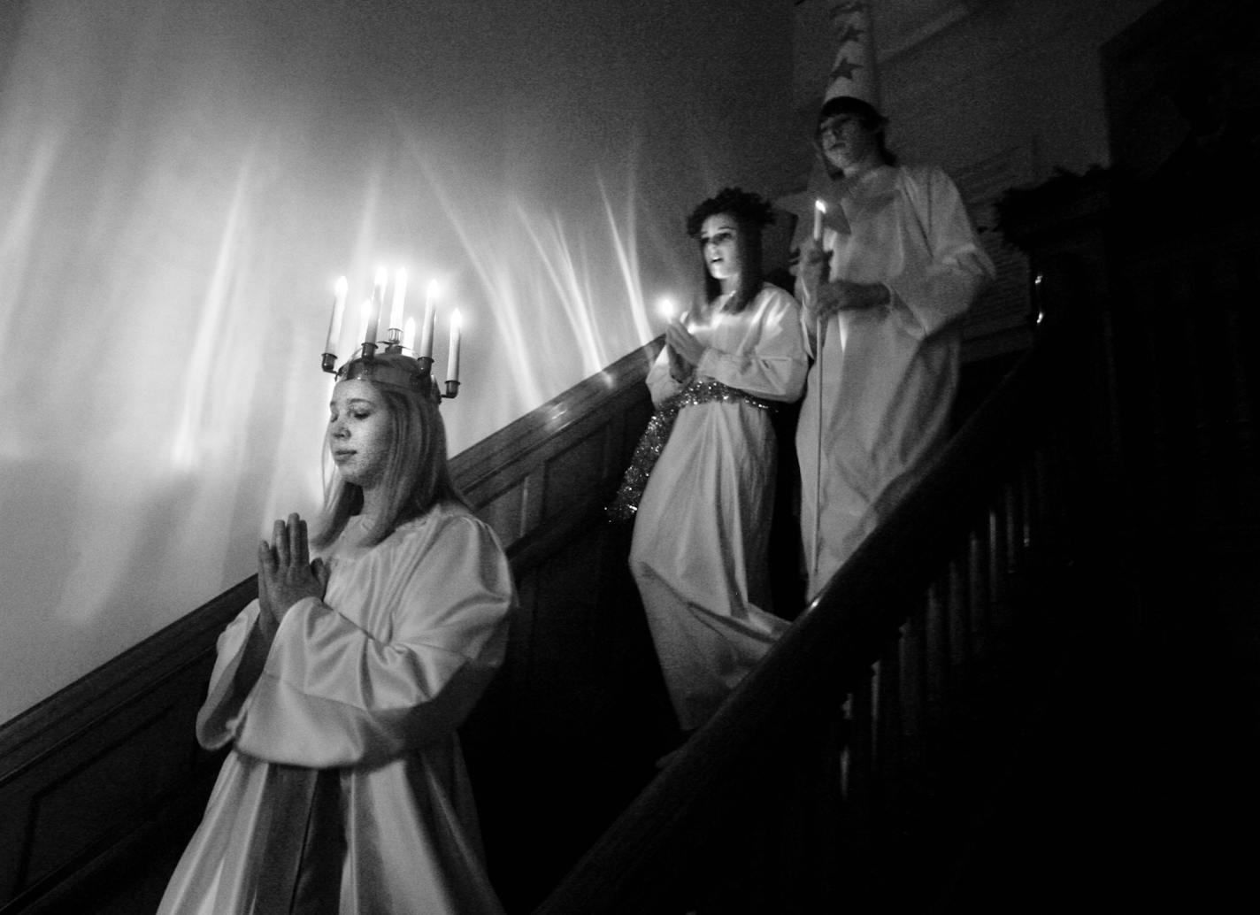 DAVID JOLES • djoles@startribune.com - Dec. 13, 2010-Minneapolis, MN-] In Sweden and other Scandinavian countries Lucia is celebrated on December 13 in a ceremony where a girl is elected to portray Lucia - an Italian saint who was said to have been adopted by the Swedes. Wearing a white gown with a red sash and a crown of candles on her head, Lucia walks at the head of a procession of girls, each holding a candle. The candles symbolize light in the darkness of winter and the fire that refused to