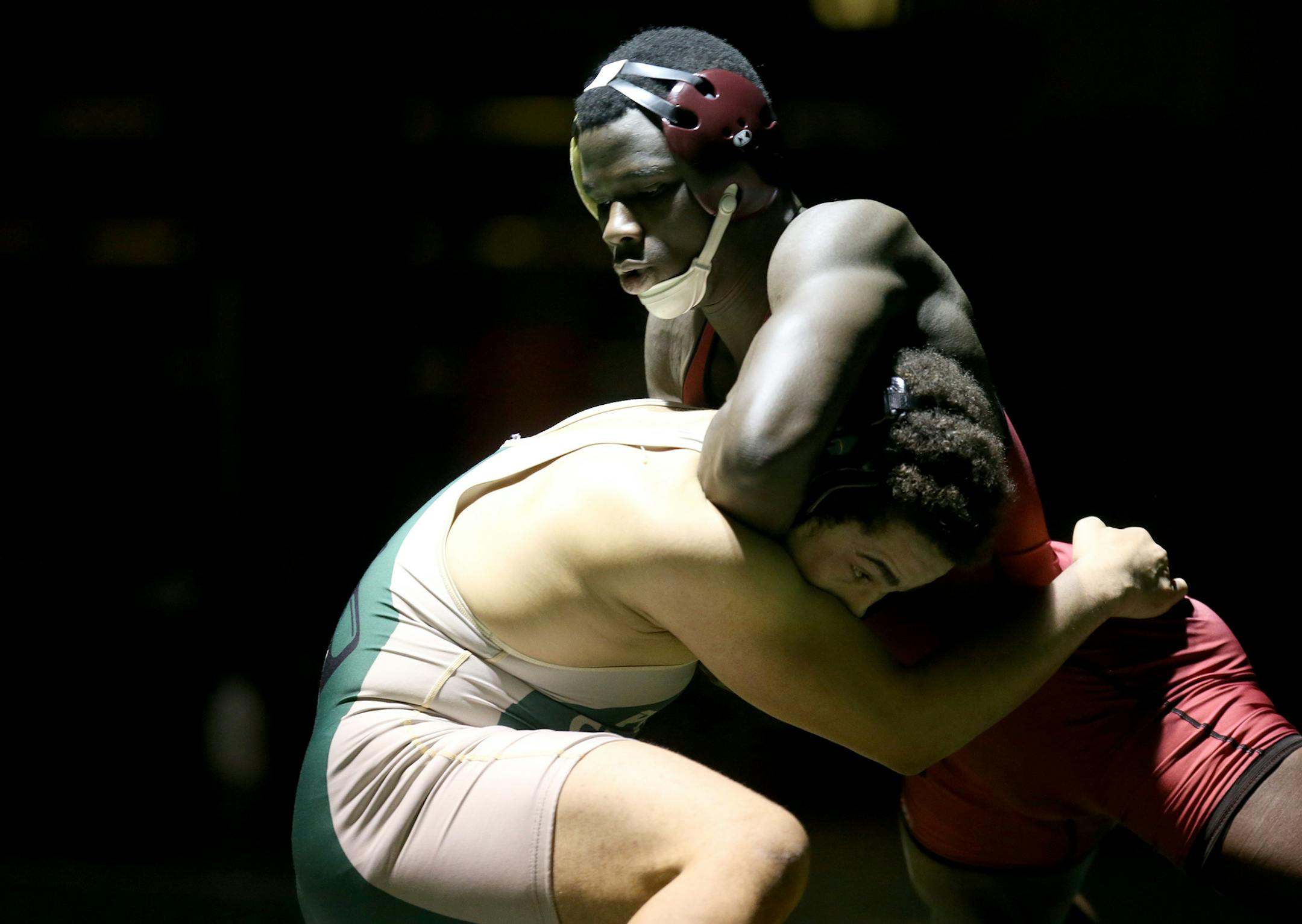 Maple Grove’s Jebah Doe, right, was shot four years ago. But he has rebuilt his life since then and hopes to compete in his second state meet this month. (Kyndell Harkness, Star Tribune)