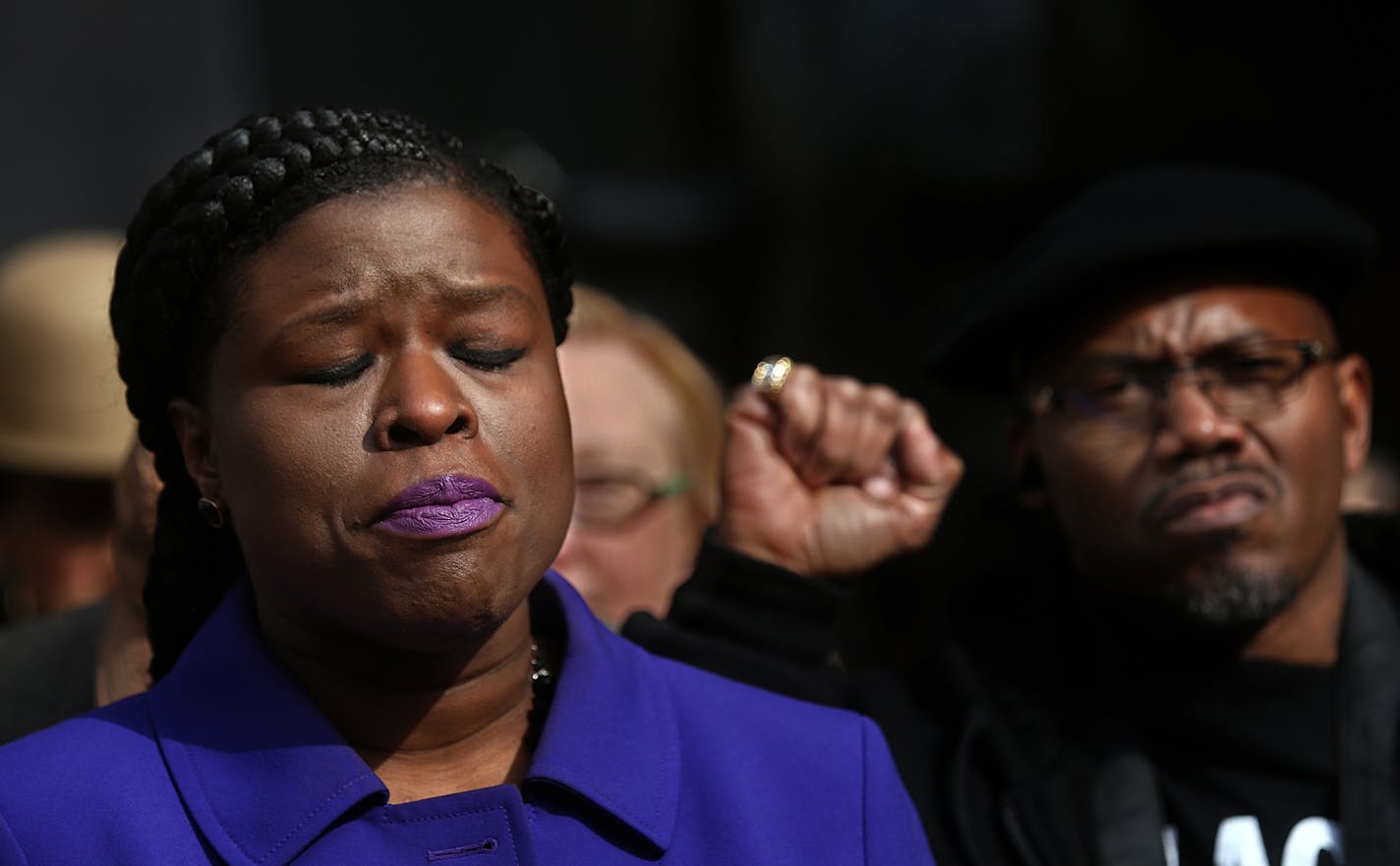 Nekima Levy-Pounds, president of the NAACP Minneapolis, addressed members of the media during a news conference on Saturday, March 25, outside Minneapolis City Hall regarding recent comments by Police Chief Janeé Harteau and the impending decision by Hennepin County Attorney Mike Freeman in the shooting death of Jamar Clark. At right is community activist Kingdemetrius Pendleton.