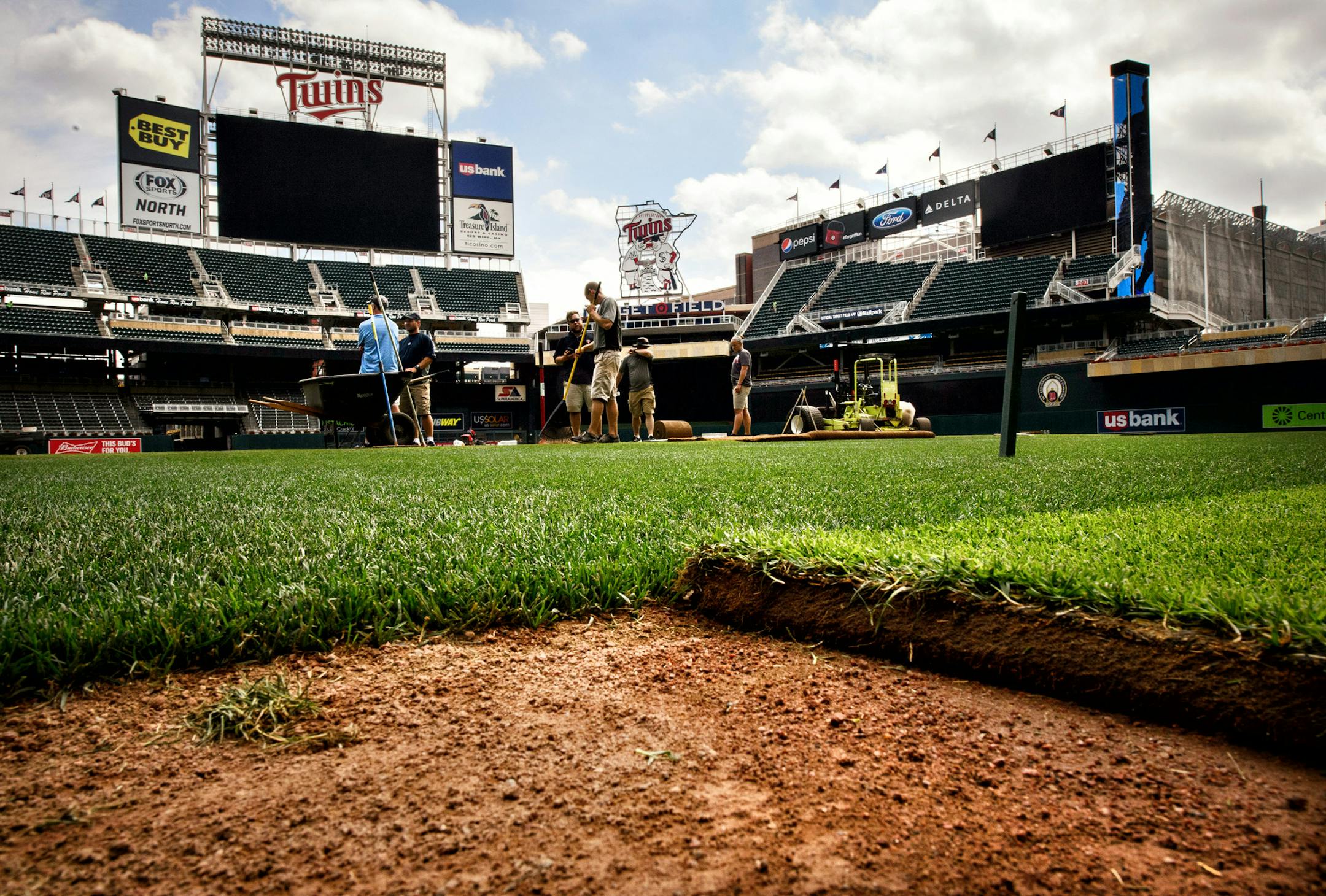Grounds crews laid sod on the Target Field infield Friday, getting the Twins’ ballpark ready for its first soccer match.