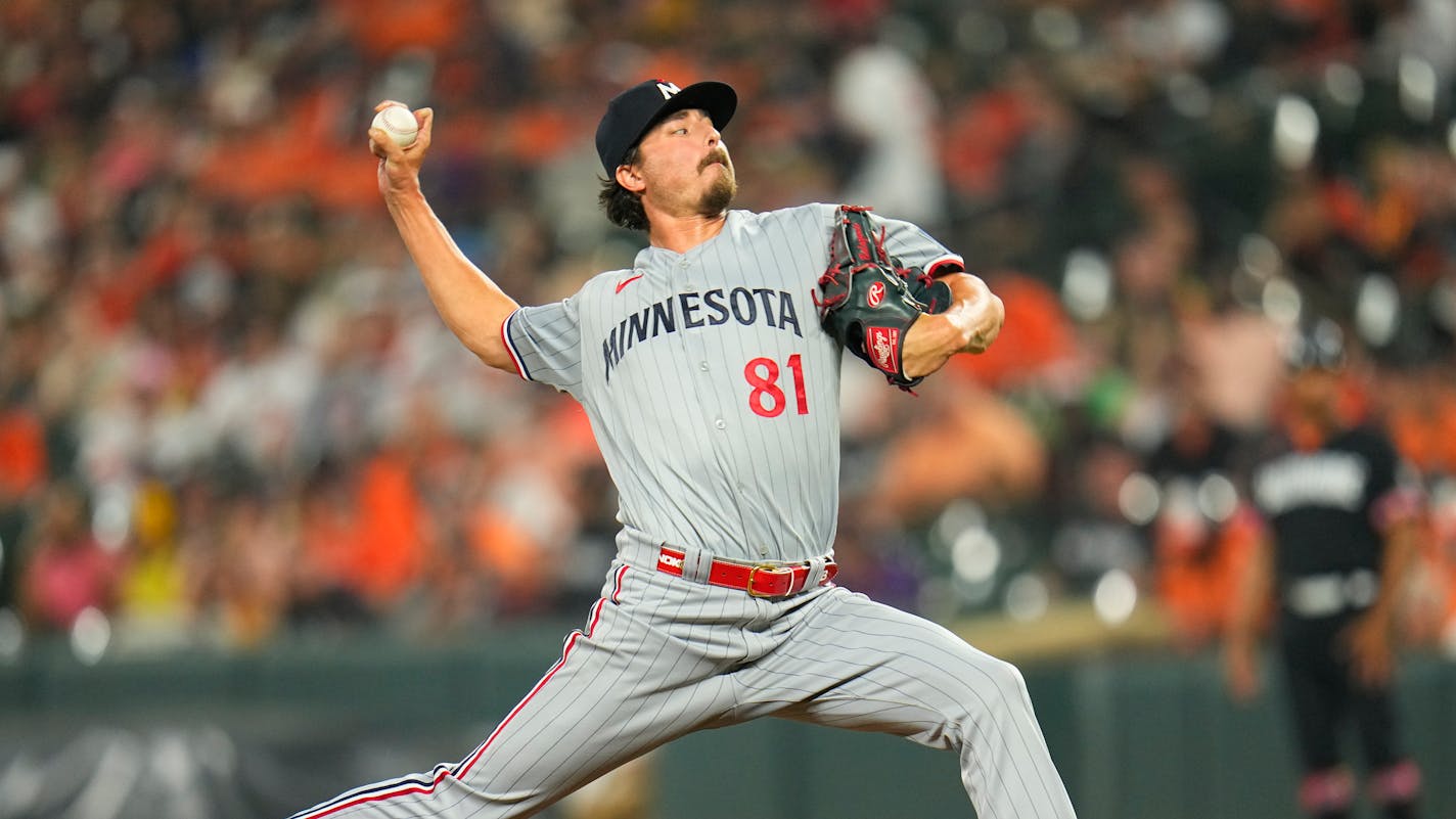 Minnesota Twins relief pitcher Jordan Balazovic throws a pitch to the Baltimore Orioles during the ninth inning of a baseball game, Friday, June 30, 2023, in Baltimore. The Twins won 8-1. (AP Photo/Julio Cortez)