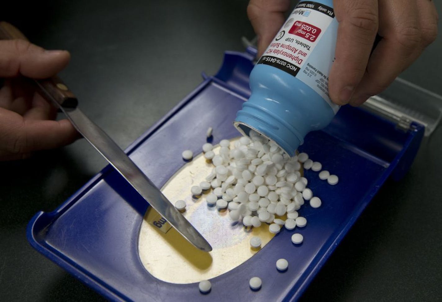 FILE - In this Friday, July 8, 2016, file photo, a pharmacy technician fills a prescription for an anti-diarrhea medication at a pharmacy, in Sacramento, Calif. Filling a prescription is no longer the simple errand you run after a doctor visit. With drug prices rising and insurance coverage shrinking, it pays to ask questions and do a little research before handing over your insurance card at the pharmacy counter. Having coverage offers no guarantee that you�re getting the best price for your me