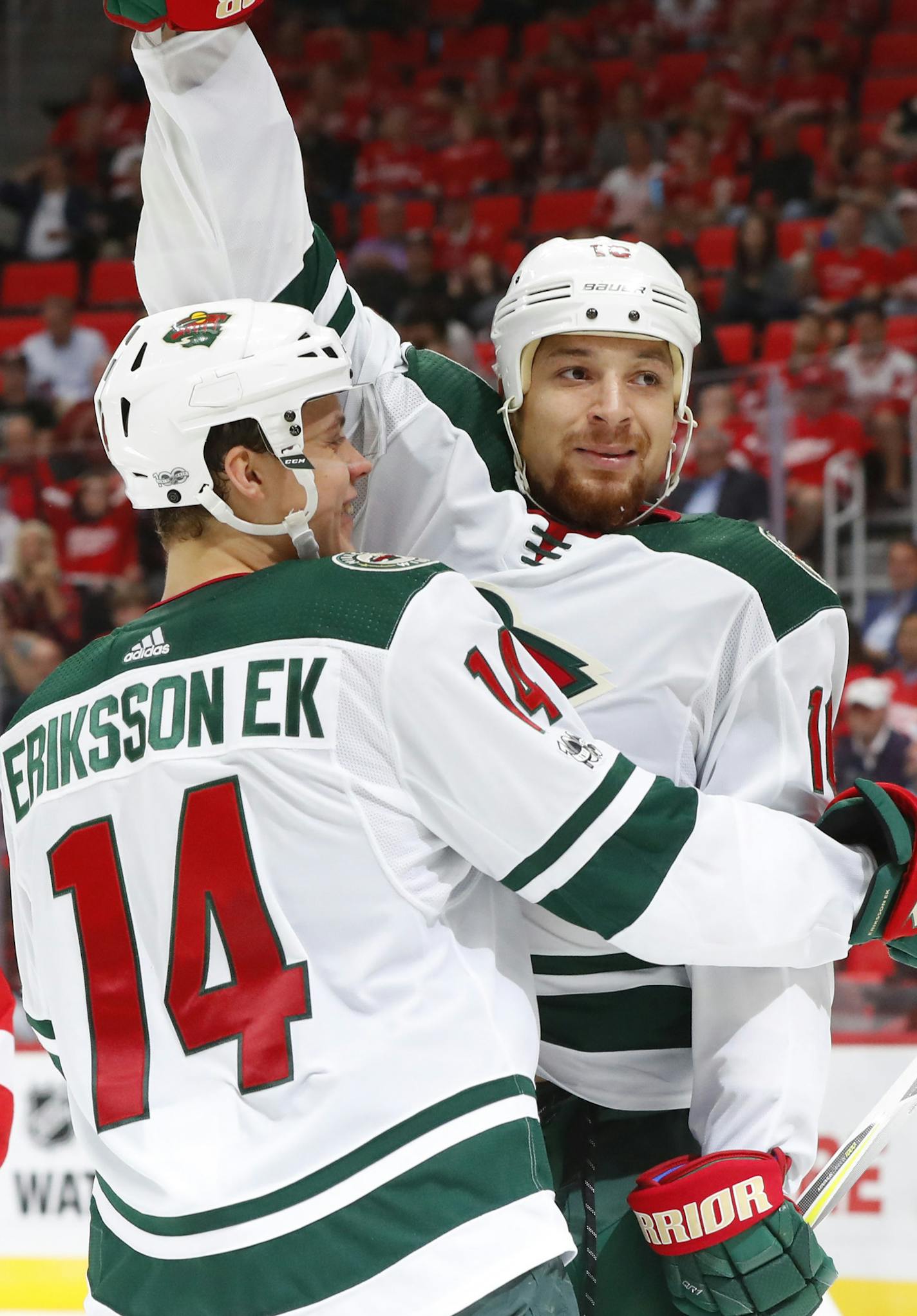 Minnesota Wild right wing Chris Stewart (10) celebrates his goal with Joel Eriksson Ek, of Sweden (14) against the Detroit Red Wings in the third period of an NHL hockey game Thursday, Oct. 5, 2017, in Detroit. (AP Photo/Paul Sancya) ORG XMIT: MIN2017100521242645