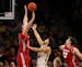 Badgers forward Nate Reuvers blocked a shot by Gophers guard Gabe Kalscheur