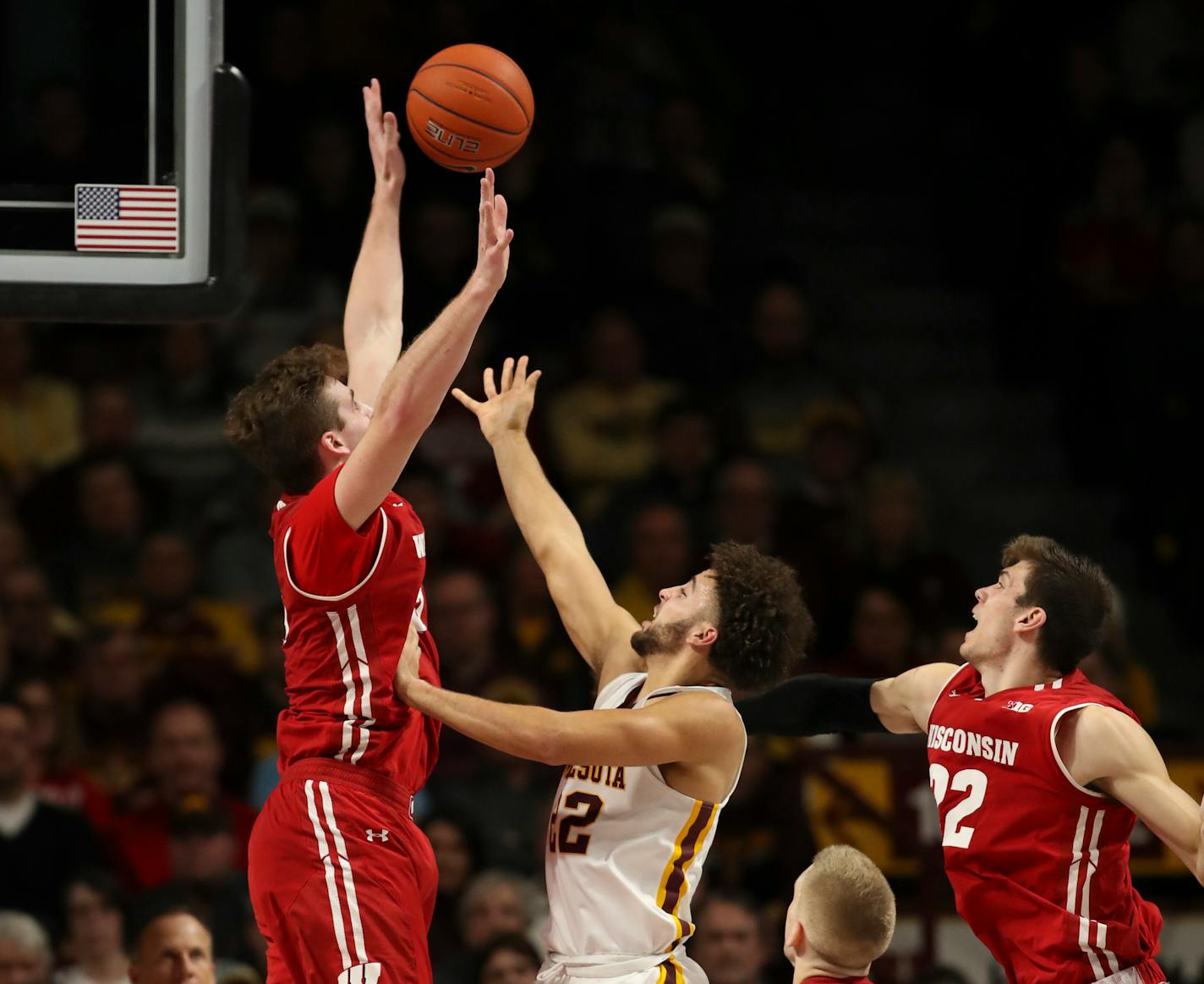 Badgers forward Nate Reuvers blocked a shot by Gophers guard Gabe Kalscheur