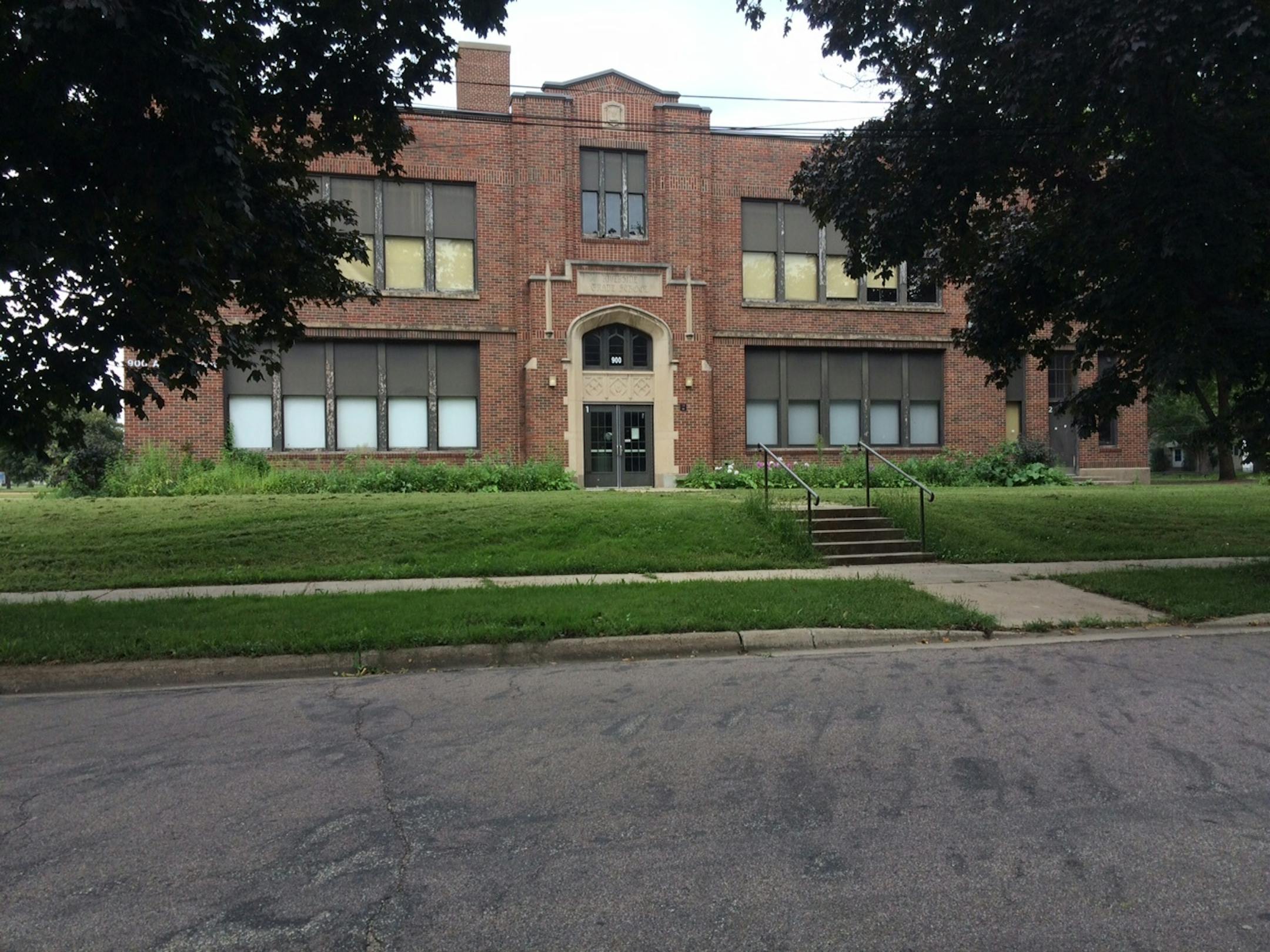 A property along W. 7th Street, owned by the St. Paul school district, contains a vacant building so old that the words carved into it read "Riverside Grade School."
