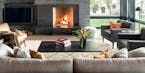 Modern fireplace in Pelican Lake house designed by Peterssen/Keller Architecture