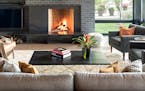 Modern fireplace in Pelican Lake house designed by Peterssen/Keller Architecture