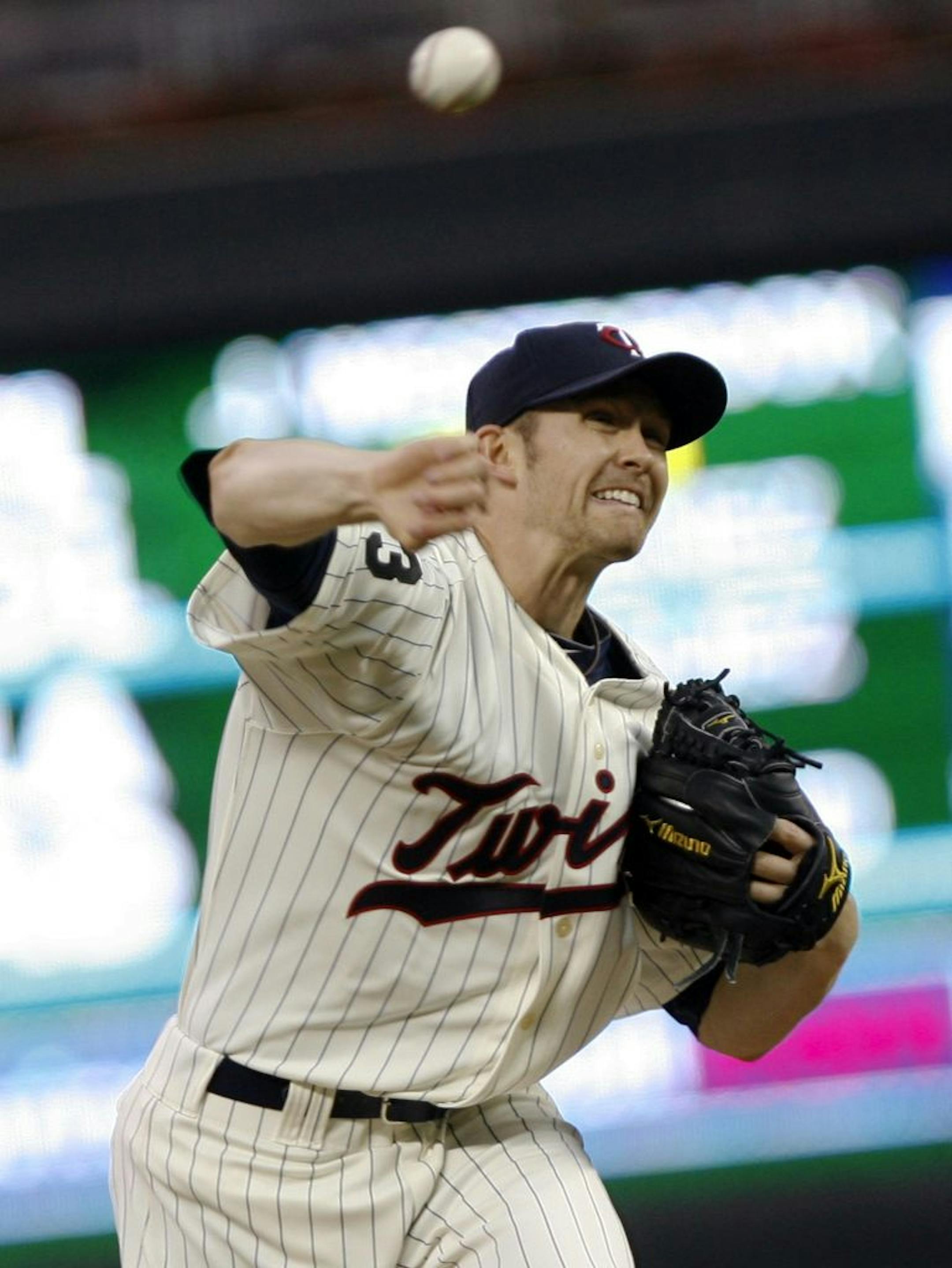 Twins starter Scott Baker fires a pitch during first inning action.
