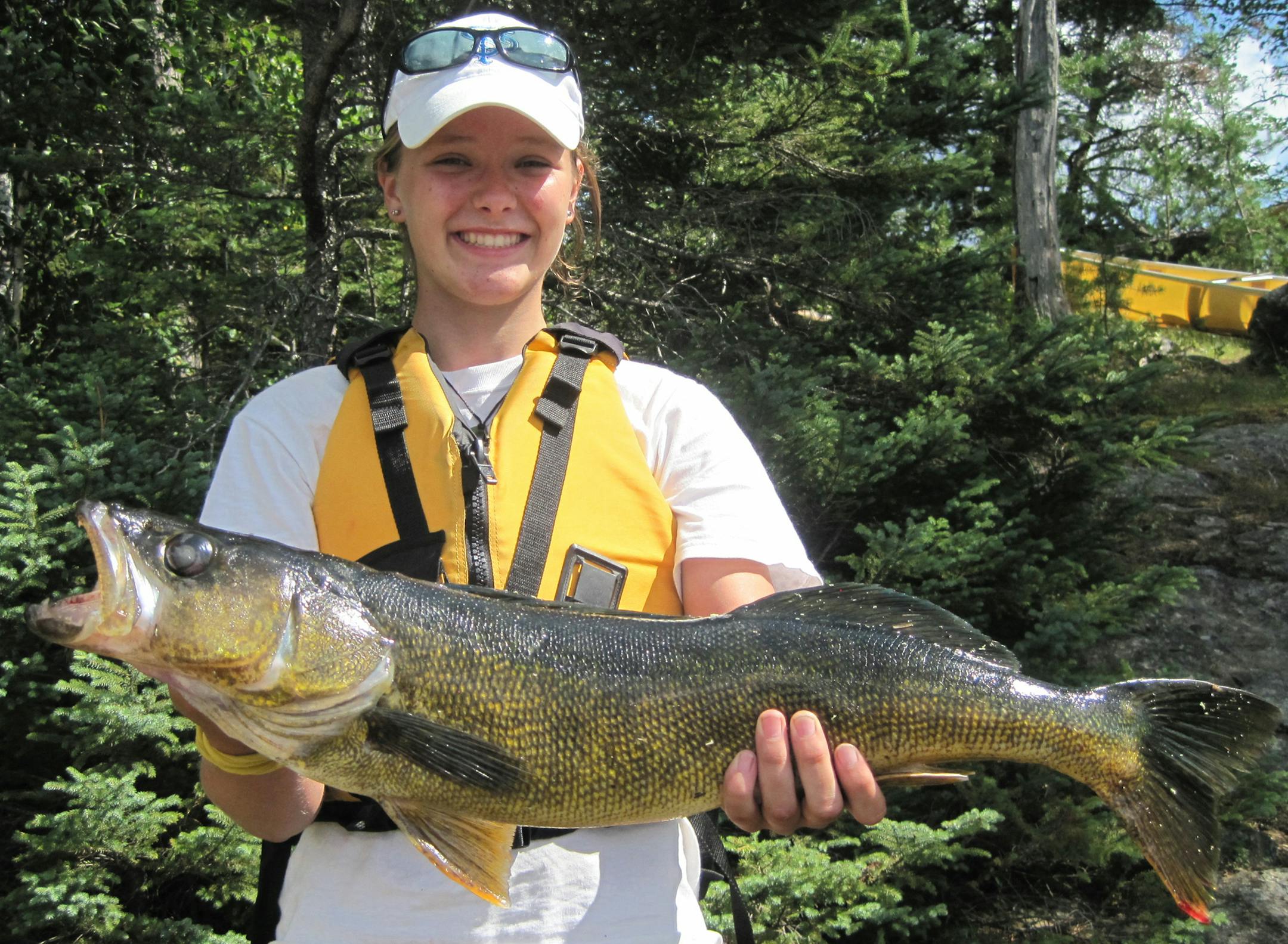 Maeve Andrews, 14, Plymouth, with 29-inch walleye she caught in 2012 in Boulder Lake (As told by her dad, John Andrews) ìMaeve was on a BWCA canoe trip with her brother, uncle and me, and on a day that included 11 portages, she caught this 29-inch walleye while casting from the canoe. She hooked it on an orange spinner, reached into the water, grabbed the fish and deposited it in the bottom of the canoe. After a couple of photos, Maeve waded into the lake and cradled the fish until it swam