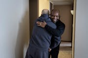 Stanislav Diborov, a recent Ukrainian refugee, hugged his housing case manager Hakizimana Emmanuel a hug as thanks for helping his family move into an